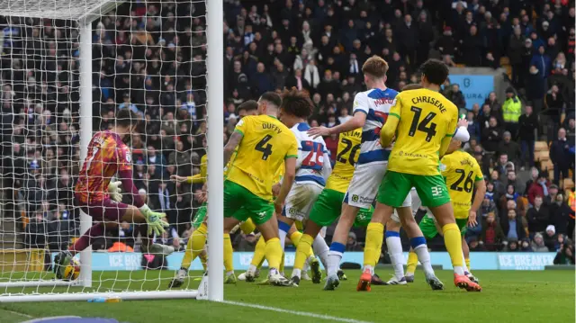 A corner deflects off Norwich's Ante Crnac and crosses the line