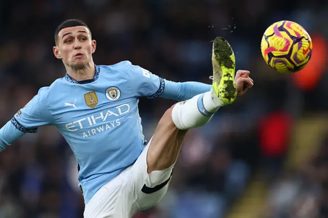 Phil Foden stretches for the ball