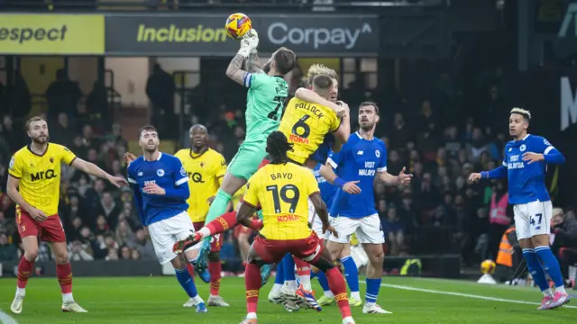 Cardiff's Jan Alnwick holds onto a cross under pressure at Watford