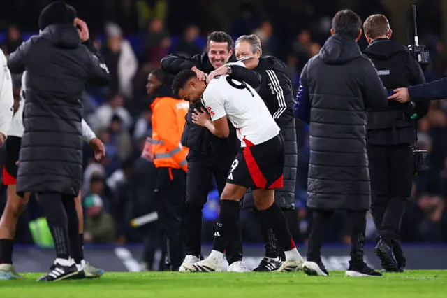 Marco Silva, Manager of Fulham, celebrates victory with Rodrigo Muniz