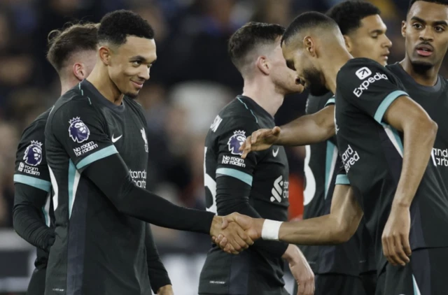 Liverpool's Trent Alexander-Arnold celebrates scoring their fourth goal with Cody Gakpo