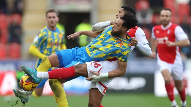 Kyle Wootton of Stockport County and Zak Jules of Rotherham