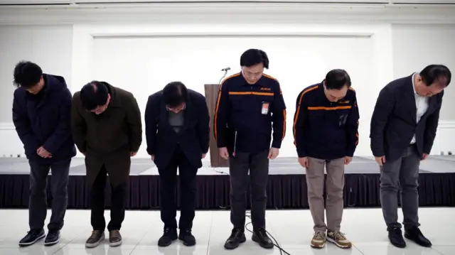 Jeju Air CEO Kim E-bae and officials bow to apologise for their plane's incident at Muan International Airport as they hold a press conference in Seoul, South Korea