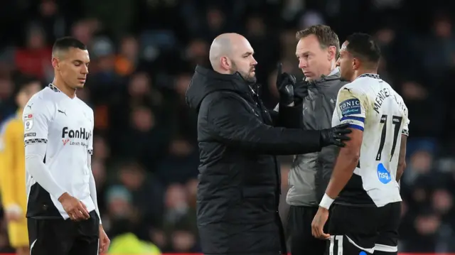 Derby captain Nathaniel Mendez-Laing receives treatment