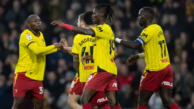 Watford players celebrate their equaliser against Cardiff