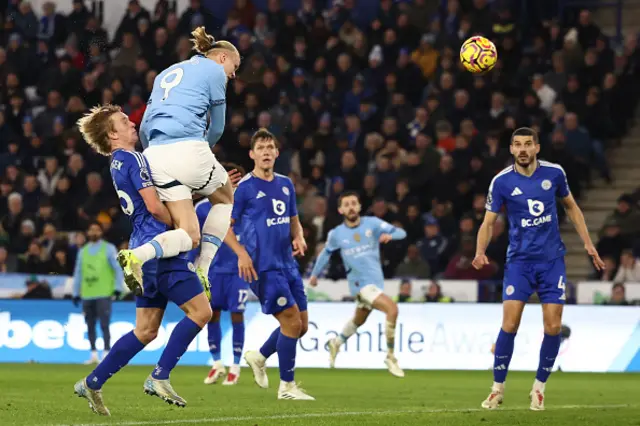 Erling Haaland (2L) heads home their second goal