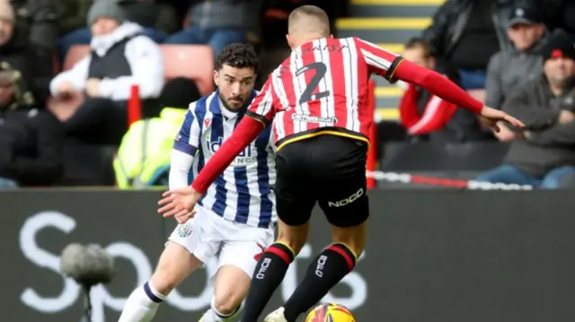 West Brom's Mikey Johnston takes on Sheffield United's Alfie Gilchrist