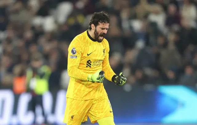 Alisson Becker celebrates