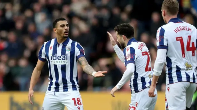 West Brom goalscorer Karlan Grant is congratulated by team-mate Mikey Johnston