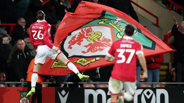 Steven Fletcher of Wrexham celebrates his goal to make it 2-1 against Wigan