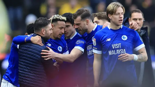 Callum Robinson and his Cardiff team-mates celebrate with Omer Riza