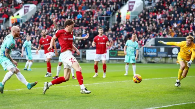 Rob Dickie scores Bristol City's third goal against Portsmouth