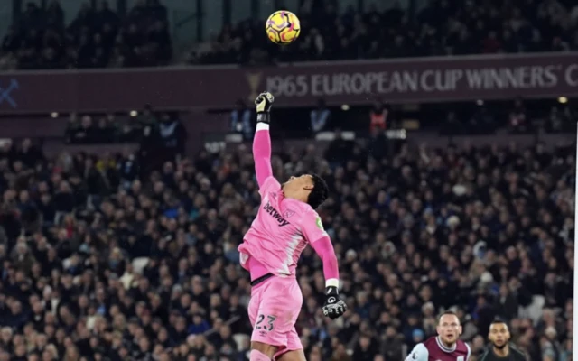 West Ham United goalkeeper Alphonse Areola attempts to clear