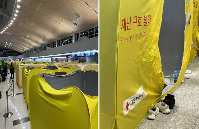 Multiple yellow shelters have been set up in the departure hall. In the left image an electronic sign reading 'Check in' can be seen. The right image is a close up of one of the tents. It has yellow writing reading 'Emergency Shelter' a pair of trainers and of boots can be seen outside. The tent is unzipped with water bottles seen just inside