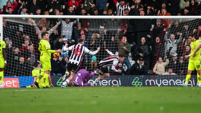 Cameron McJannet celebrates after scoring for Grimsby Town