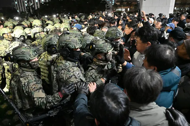 Soldiers try to enter the National Assembly building in Seoul