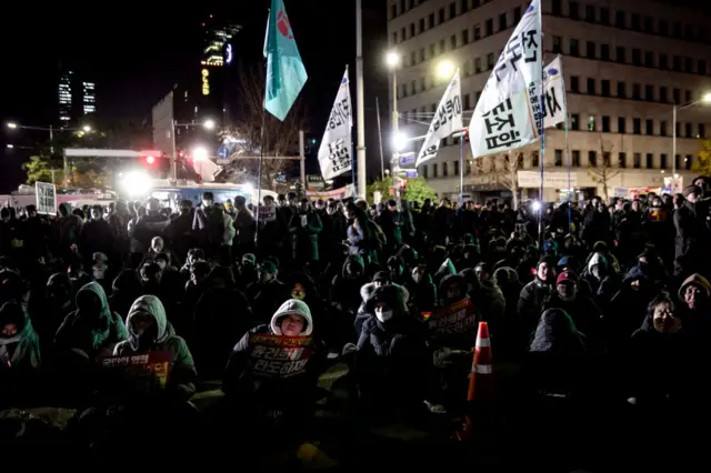 Protesters against South Korean President Yoon Suk Yeol call for his impeachment while occupying the street outside the National Assembly in Seoul,