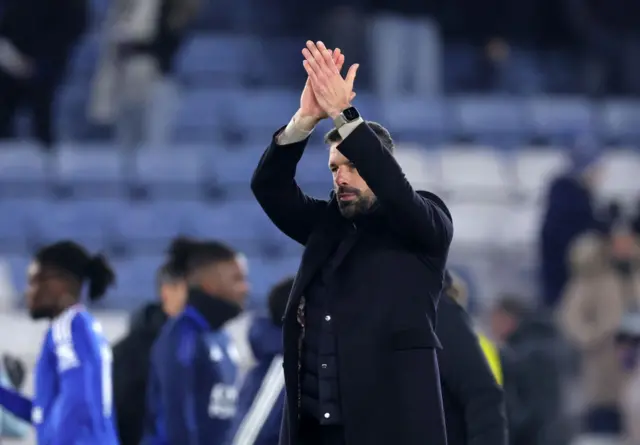 Van Nistelrooy claps the home fans at full time