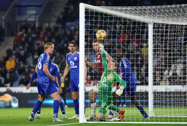 Hermandsen is bundled into the net with the ball