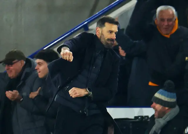 Van Nistelrooy pumps his fist emphatically after his side's third goal