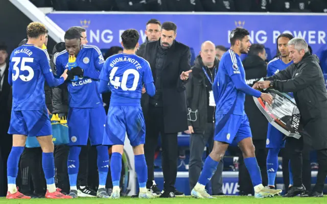 Van Nistelrooy speaks to his players during a stoppage in play