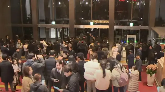 People crowd into National Assembly Building