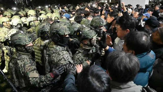 Soldiers try to enter the National Assembly building in Seoul after South Korea President Yoon Suk Yeol declared martial law