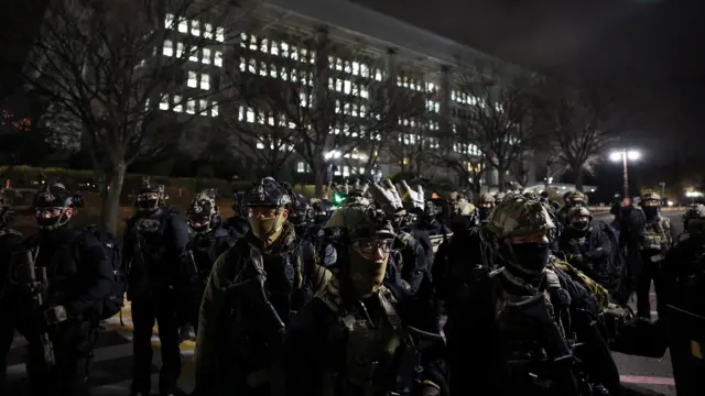 Military forces stand outside the National Assembly