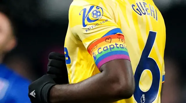 Marc Guehi wears a rainbow armband for Palace