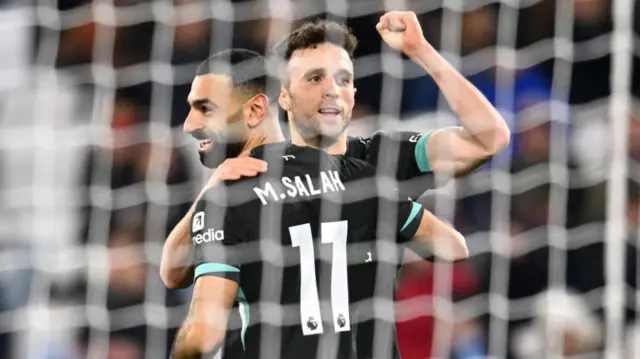 Diogo Jota celebrates with Mohamed Salah