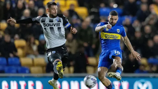 AFC Wimbledon forward Omar Bugiel (18) shoots during the EFL Sky Bet League 2 match between AFC Wimbledon and Gillingham at Plough Lane, London