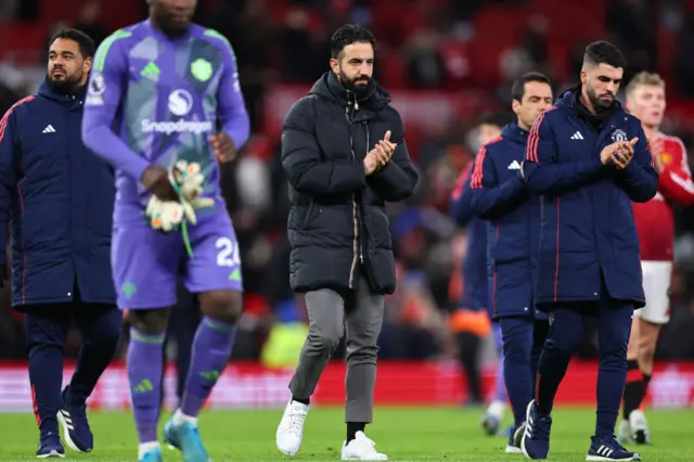 A dejected Ruben Amorim the head coach / manager of Manchester United walks off at full time