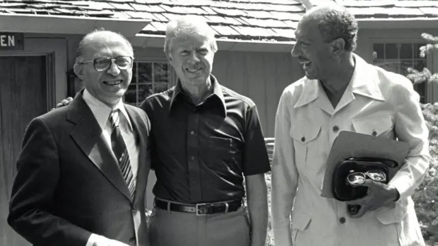 President Jimmy Carter with Egyptian President Anwar al Sadat (R) and Israeli Prime Minister Menachem Begin during Middle East peace negotiations at Camp David