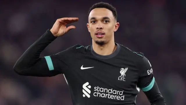 Trent Alexander-Arnold gestures with his hand after scoring for Liverpool