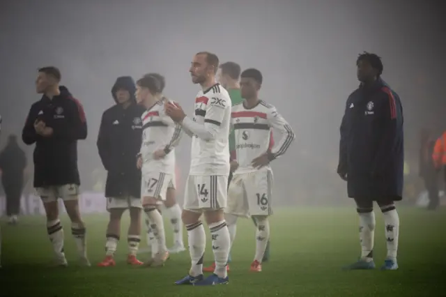 Man Utd players clap the travelling fans after losing to Wolves