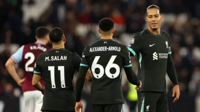 Liverpool players Mo Salah, Trent Alexander-Arnold and Virgil van Dijk