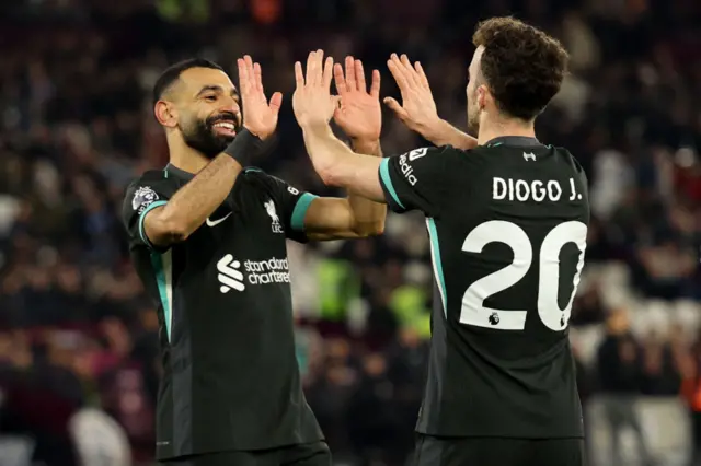 Diogo Jota celebrates with Mo Salah