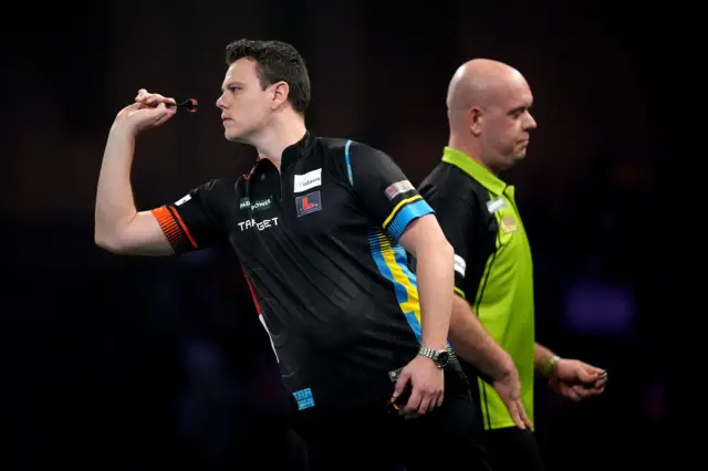 Jeffrey de Graaf throws during his match against Michael van Gerwen during day thirteen of the Paddy Power World Darts Championship at Alexandra Palace, London