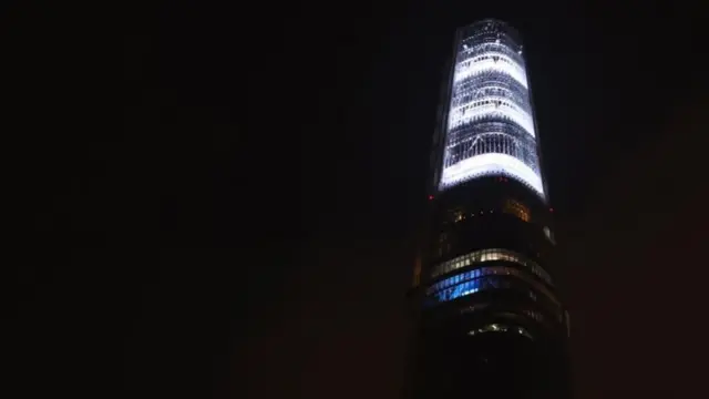 Lotte World Tower in southern Seoul lights up the upper part of the skyscraper to mourn the victims