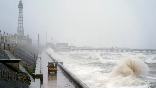 A large wave crashes on the shore in Blackpool