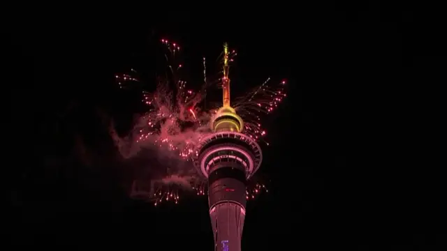 Fireworks appear to come out of the New Zealand Sky Tower