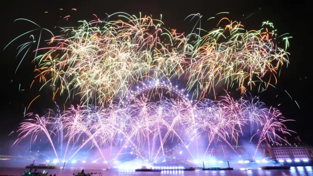 Fireworks explode over the London Eye Ferris