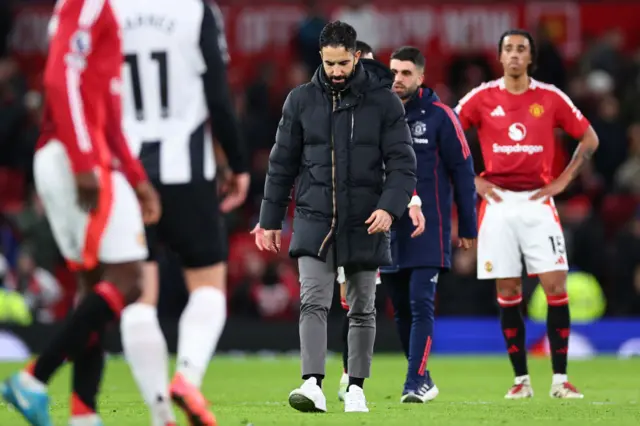 Machester United manager walks off the Old Trafford pitch