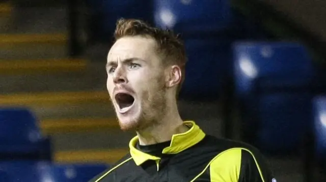 Tom Naylor celebrating with his mouth open after scoring for Burton Albion.
