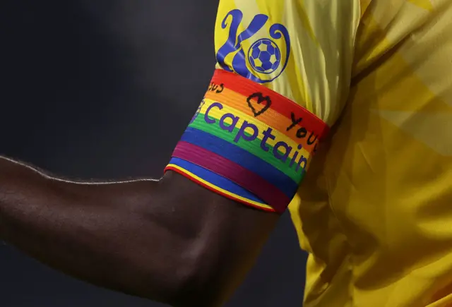 Marc Guehi's rainbow armband with the words 'Jesus Loves You' written on it.