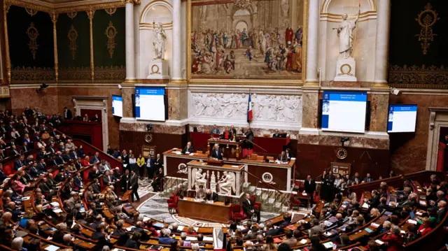 French Prime Minister Michel Barnier delivers a speech during a no-confidence vote against his government