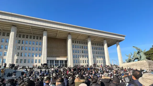 Crowds in front of the steps at the National Assembly in Seoul.