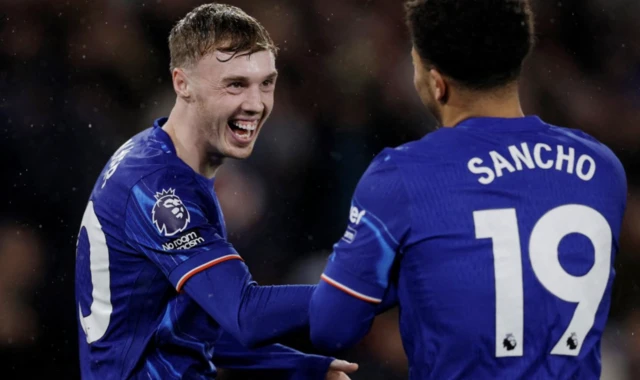 Chelsea's Cole Palmer celebrates scoring their fourth goal with Jadon Sancho