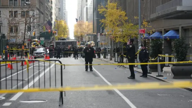 Police tape covers the scene of the attack outside the Hotel Hilton in Midtown