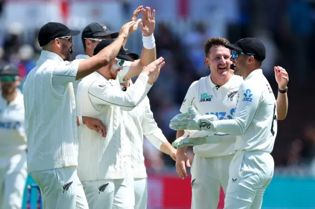 Nathan Smith and Tom Blundell celebrate the wicket of Jacob Bethell